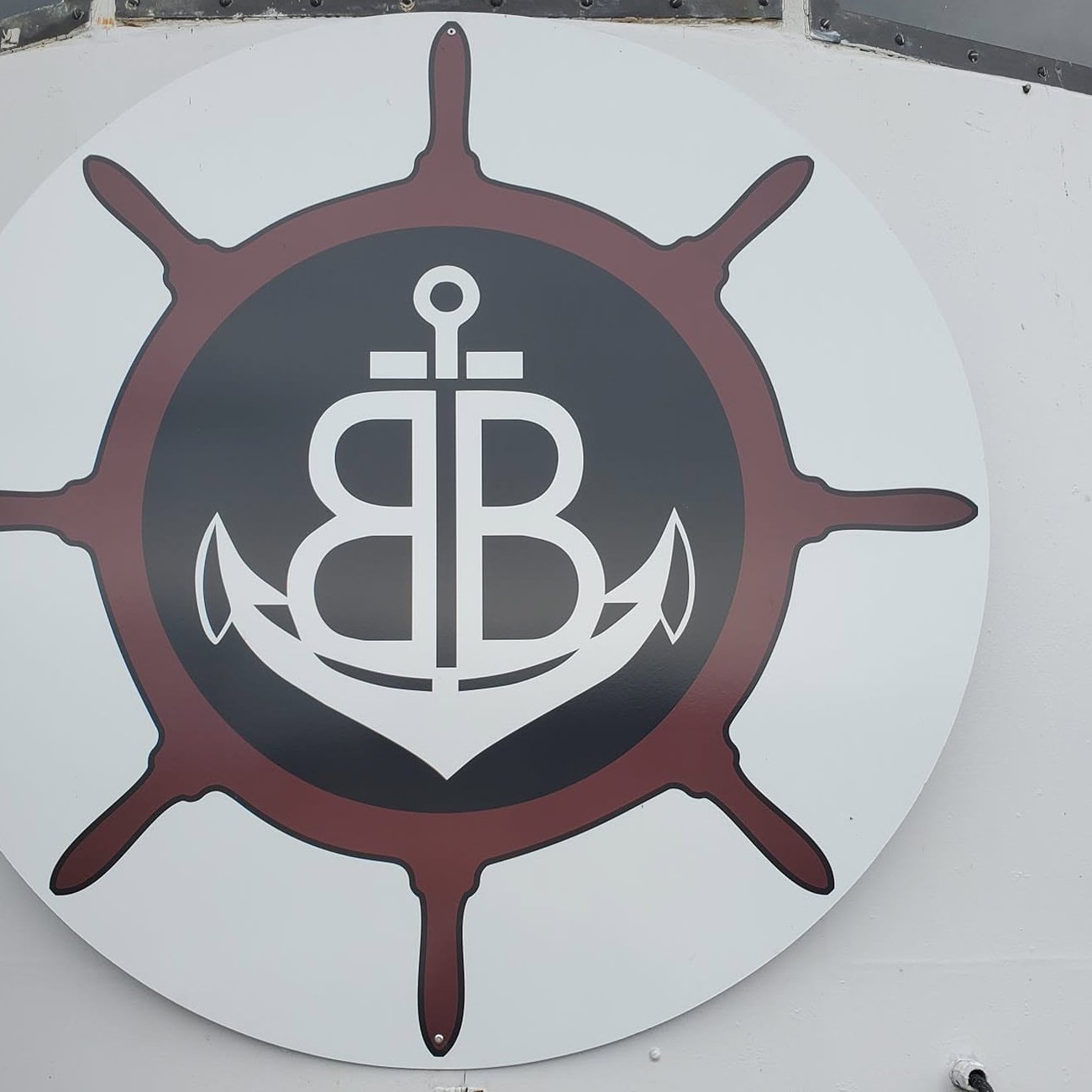 The Bum Boat wheel and anchor logo